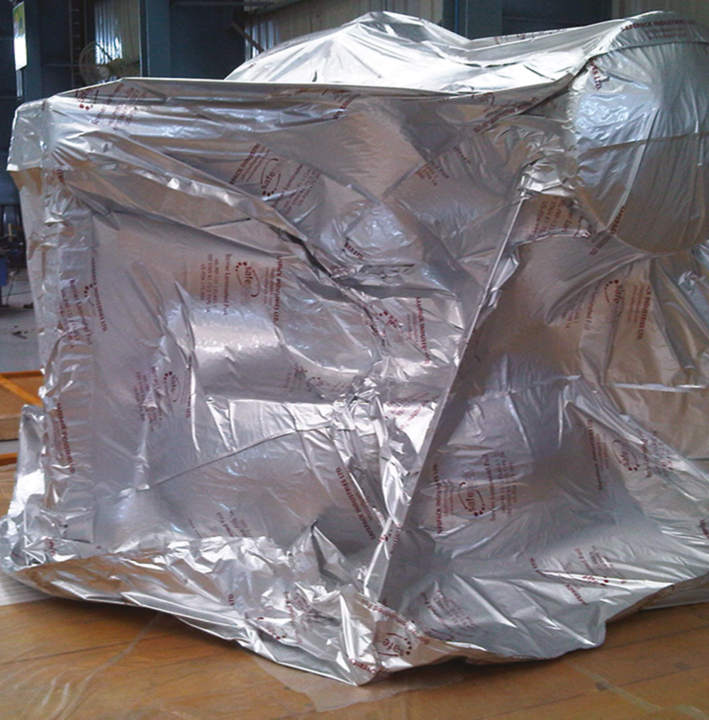 Silver barrier vacuum packaging around industrial equipment